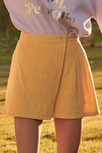 Willa Woven Front Button Wrap Back Pleated Mini Skirt